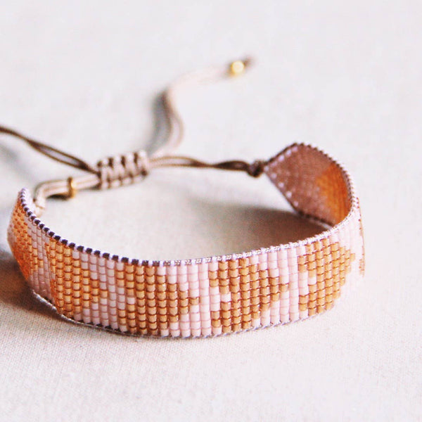 Bracciale in tessuto con cuori | nudo/beige