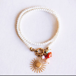 Collana | Perle con sole e grappolo di gemme