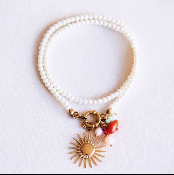 Collana | Perle con sole e grappolo di gemme